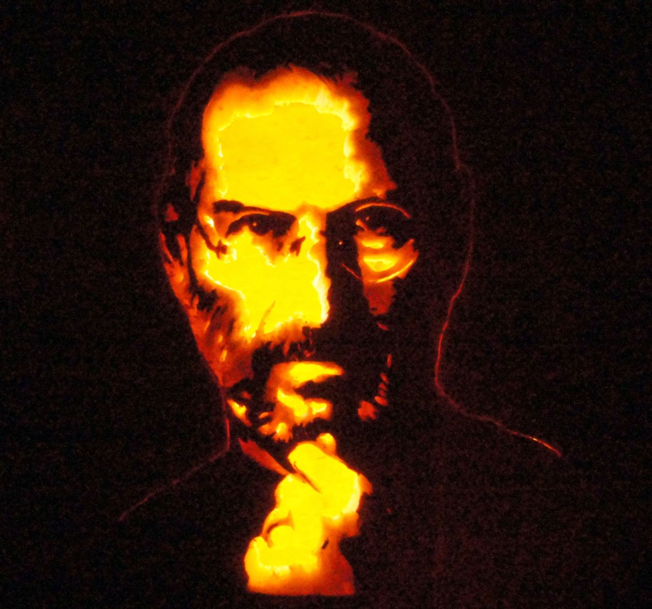 Keyvin Pollington of Sandy, Utah, "painted" a portrait of Apple founder Steve Jobs by copying an iconic photograph. He created subtle changes in shading by carving away different thicknesses of the pumpkin wall without cutting all the way through.