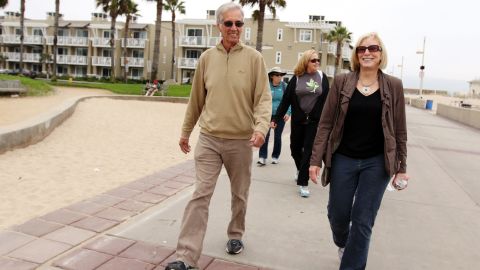A "walking Moai" takes a walk down The Strand in Redondo Beach, California.