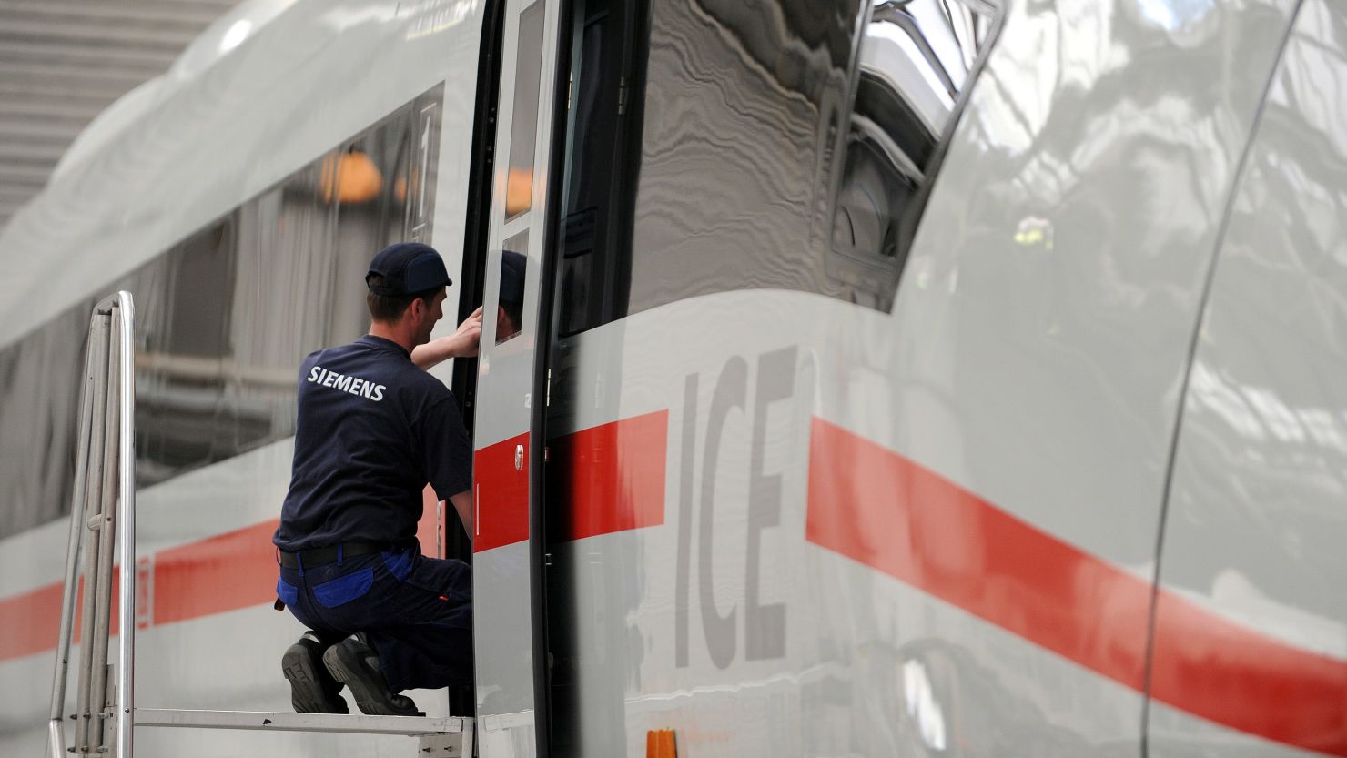 An employee of German industrial giant Siemens works on an ICE 3 high speed train.