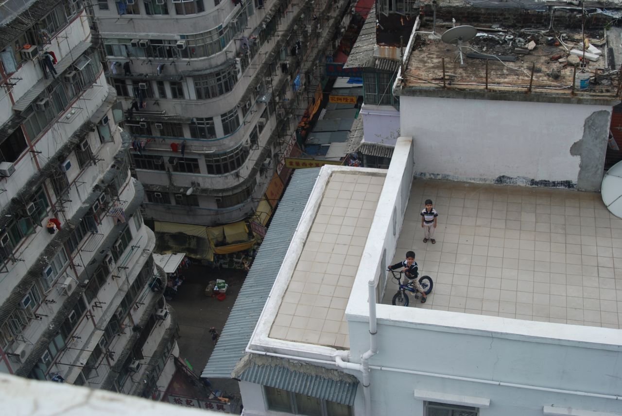 Children on a rooftop playground in Sham Shui Po.