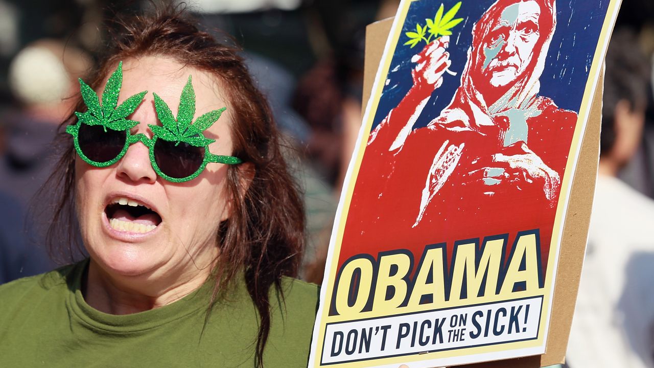 Medical marijuana advocate The Holy Hemptress protests outside of the hotel where President Obama was staying on Tuesday.