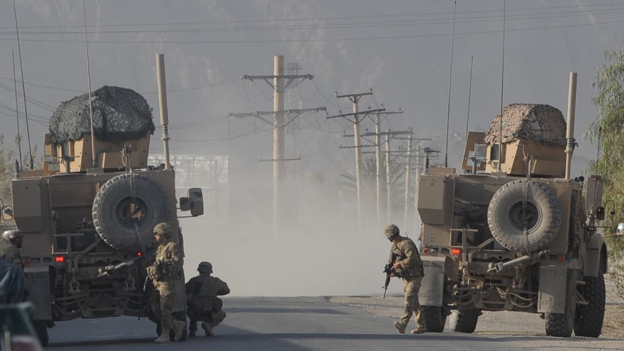 US soldiers keep watch on site during a gunfire near a US base in Kandahar on October 27.