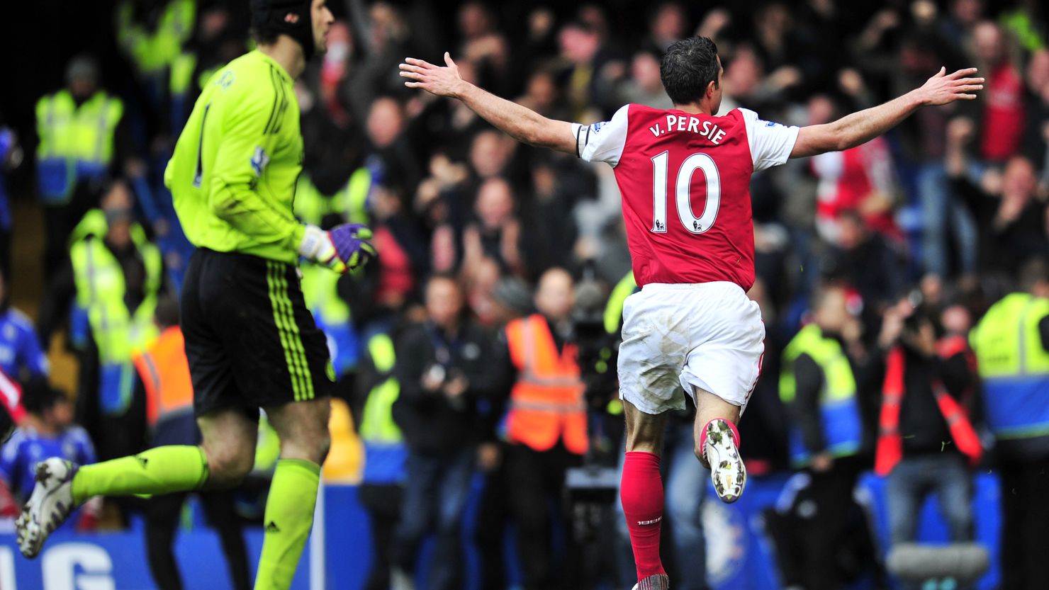 Robin van Persie celebrates scoring his second, and Arsenal's fourth goal against Chelsea at Stamford Bridge.