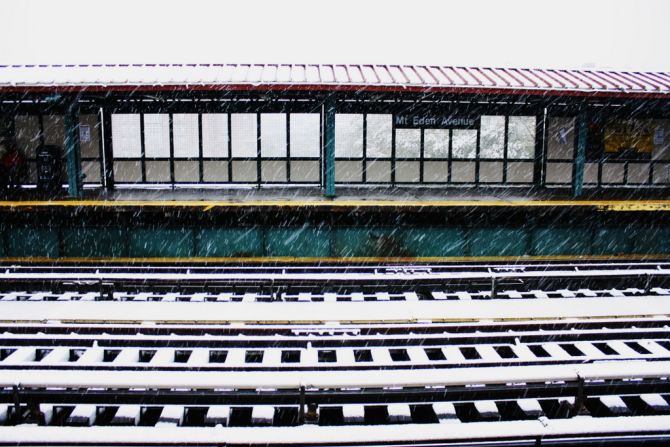 Snow covers the tracks of a New York subway station. Hundreds of thousands of people had lost electricity as of Saturday afternoon.