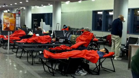 JetBlue passengers sleep on cots at Hartford, Connecticut's Bradley International Airport.
