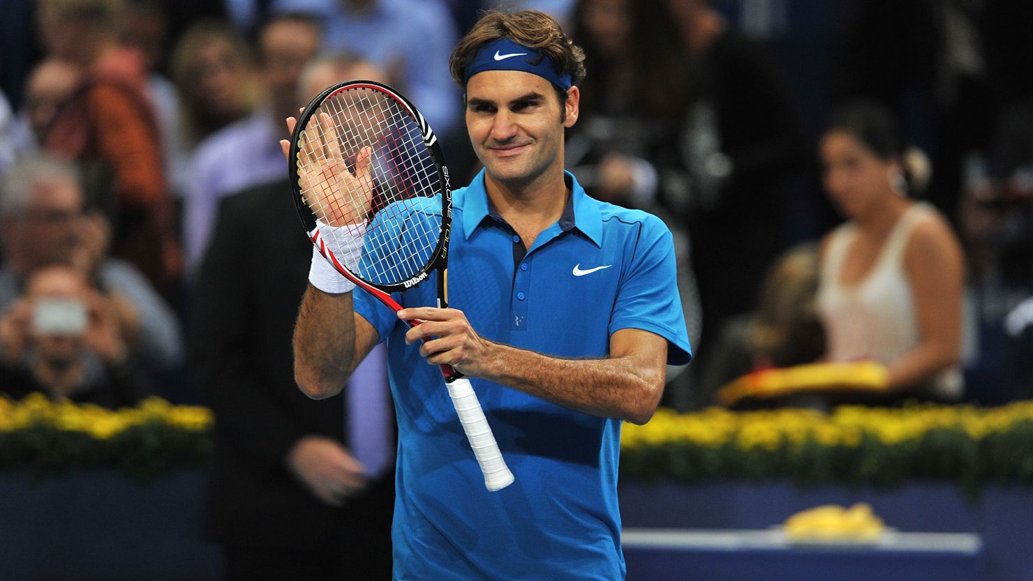 Roger Federer applauds his home crowd after winning his opening match in Basel.