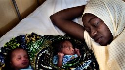 A mother with her newborn twins at the maternity-labor ward in the Federal Medical Centre, Katsina, Nigeria.