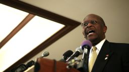 Herman Cain talks at an event in Alexandria, Virginia, Tuesday, and then left without answering reporters' questions about sexual harassment accusations that have surfaced from the time when he was the head of the National Restaurant Association. (Photo by Alex Wong/Getty Images)
