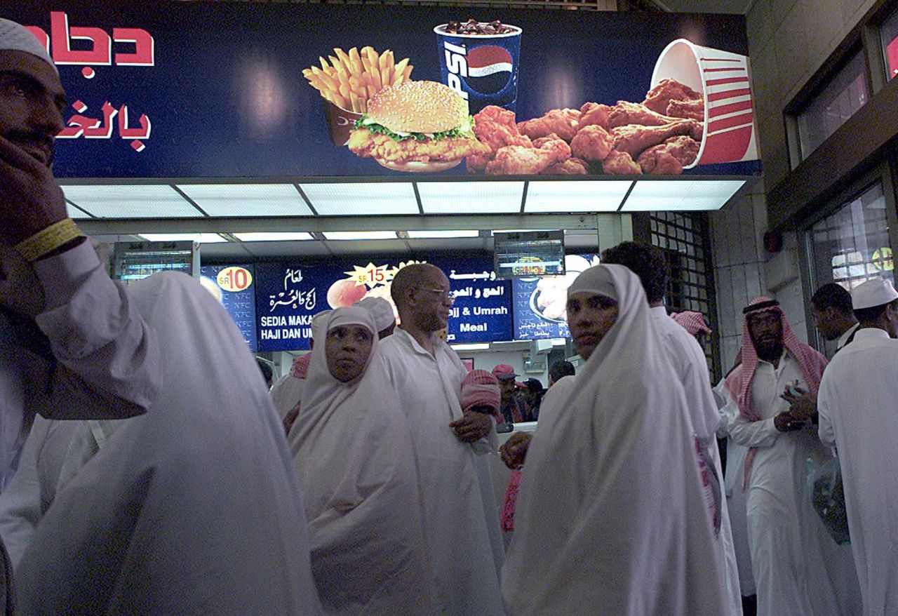 Pilgrims gather at a branch of the Kentucky Fried Chicken fast-food outlet in Mecca during the Hajj. The Green Pilgrimage Network seeks promote eating fairtrade and locally sourced food.