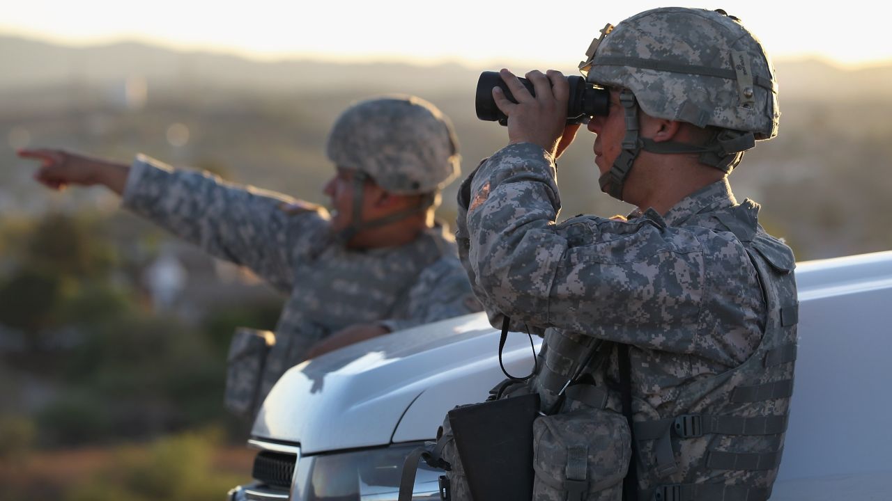 U.S. Army National Guardsmen scan the US-Mexico border in June 2011 in Nogales, Arizona. 