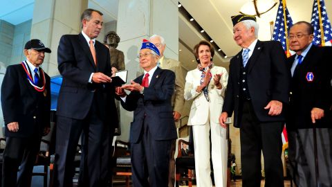Speaker of the House John Boehner, left, hands the Congressional Gold Medal to a Japanese-American veteran on Wednesday.