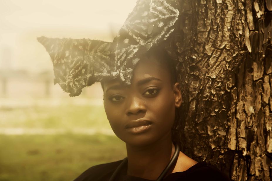 A model displays a butterfly shaped head piece from the Maki Oh collection of Nigerian designer, Amaka Osakwe.