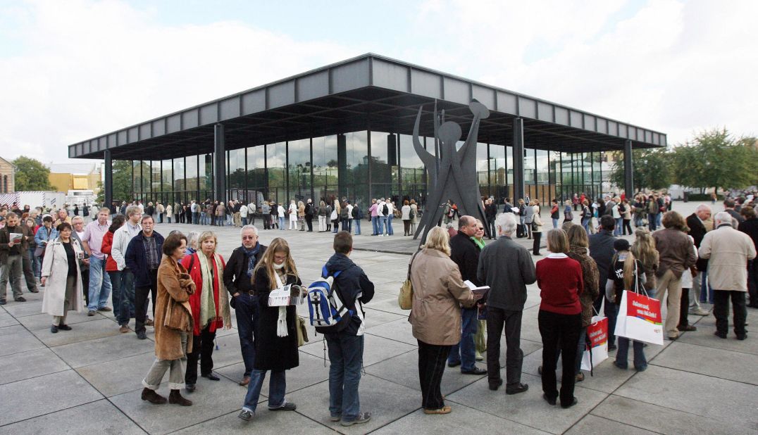 Visitors queue outside the Neue Nationalgalerie in Berlin, Germany. Adjaye cites the structure as a "masterpiece" and "a temple of modernity."
