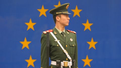 Chinese paramilitary policeman stands guard outside the European Union Delegation in Beijing on October 30, 2011.
