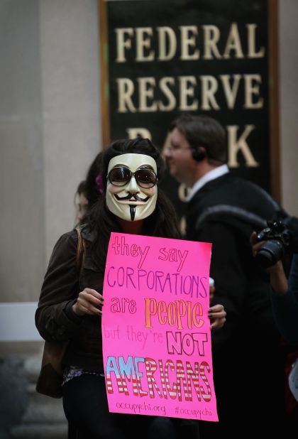 Masked Anonymous Protesters Aid Time Warner's Profits - The New York Times