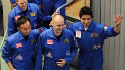 Members of the Mars500 crew Alexey Sitev of Russia smile for the press before being locked into the Mars500 isolation facility in Moscow on June 3, 2010.