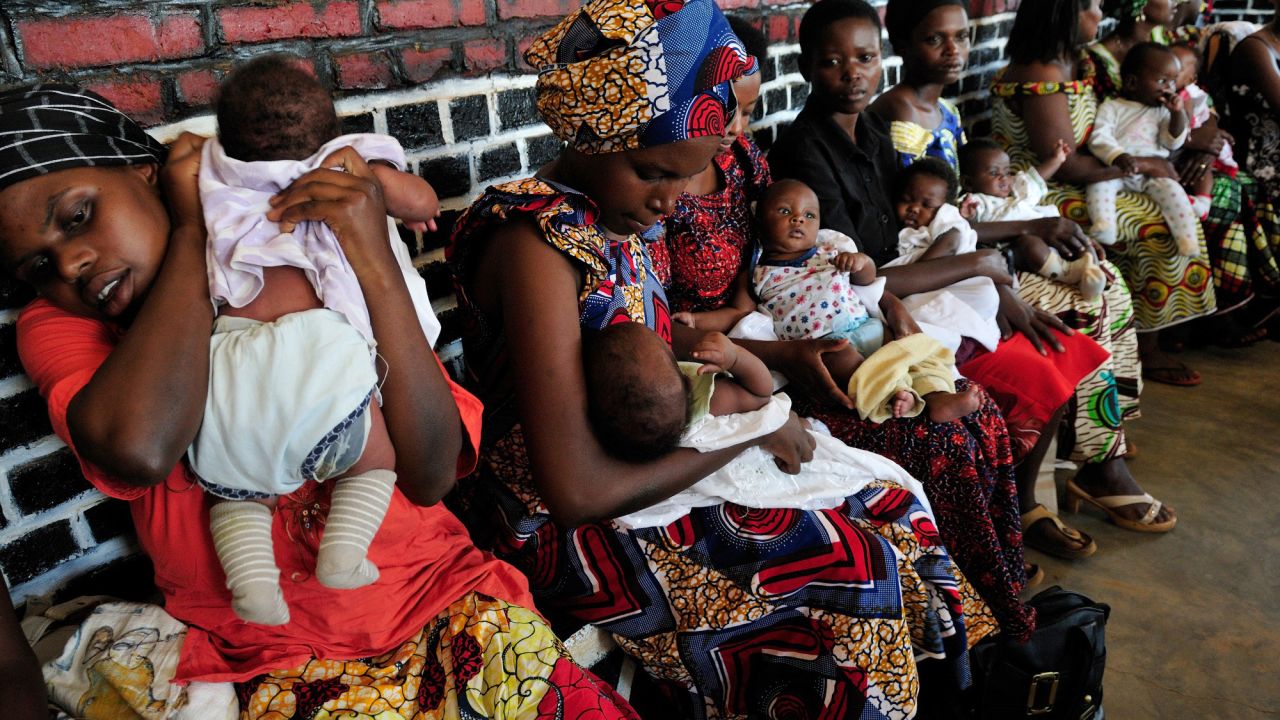 Melesse says that the rapid population growth of 2.3 per cent a year in Africa places pressure on governments struggling to provide education and health services. Here we see Rwandan mothers soothing their newborns after being vaccinated at a local clinic.