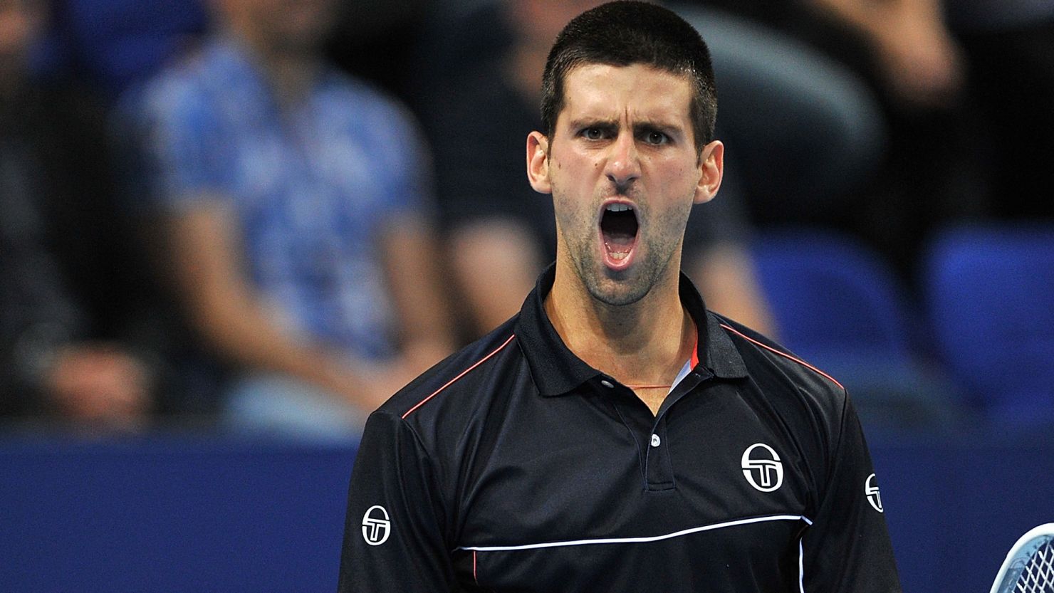 Novak Djokovic reacts to winning a point in his three-set victory over Marcos Baghdatis