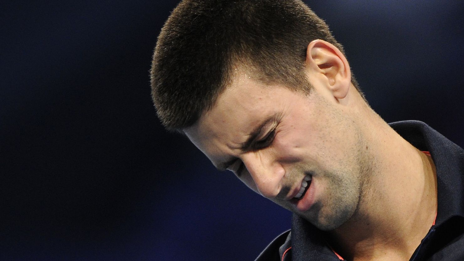 Serbian tennis star Novak Djokovic grimaces during Saturday's defeat by Kei Nishikori in Switzerland.
