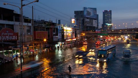 Traffic braves flood waters in the Lat Phrao shopping and business of Bangkok, Thailand on November 4, 2011.