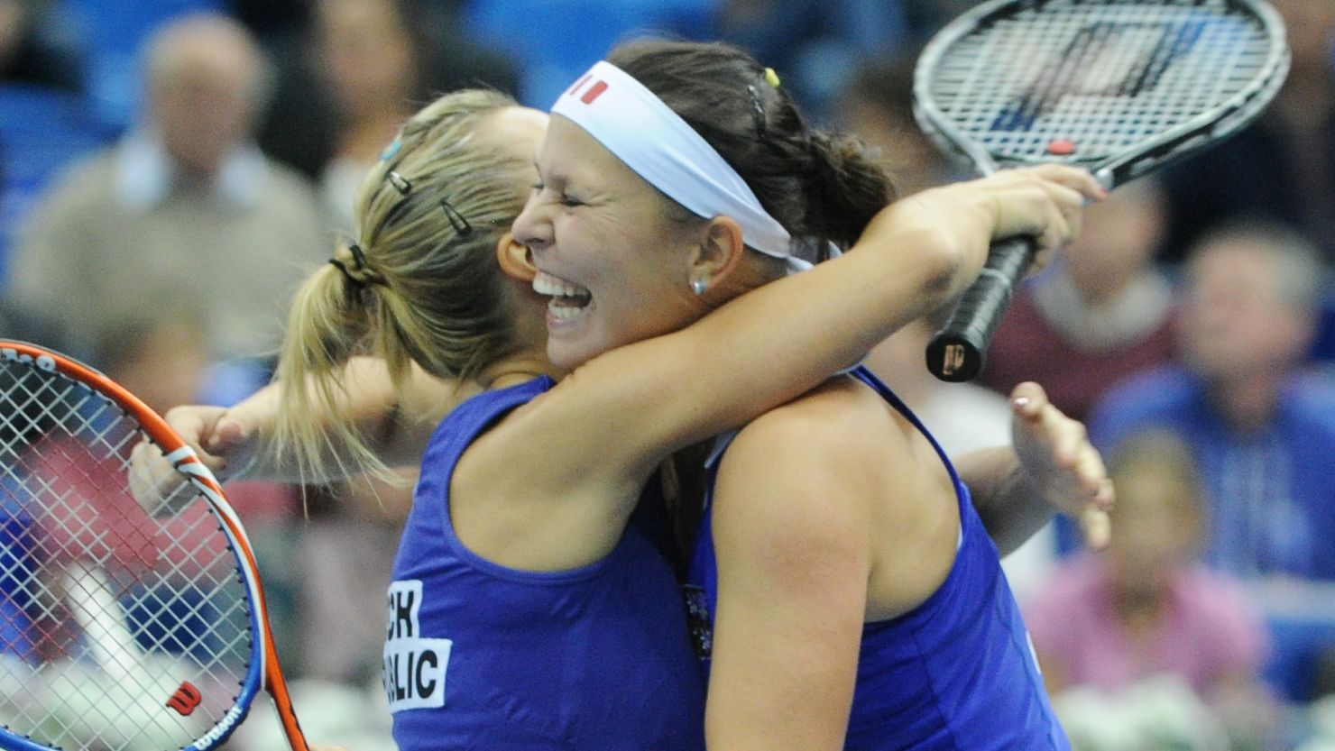 Lucie Hradecka (right) and Kveta Peschke celebrate their Fed Cup doubles success over Russia.