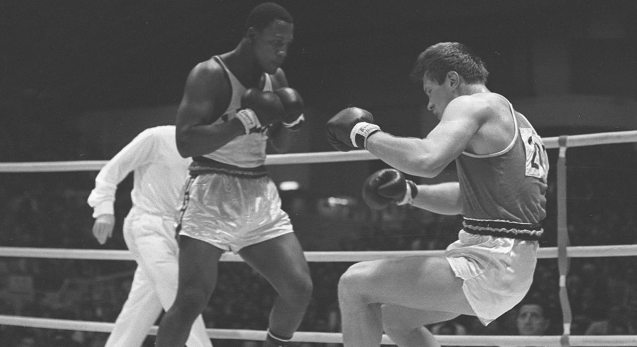  Joe Frazier and Russian Vadim Yemelyanov fight in a semifinal at the Olympic Games in Tokyo in 1964. Frazier went on to win gold. 