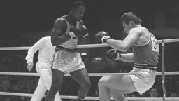  Joe Frazier and Russian Vadim Yemelyanov fight in a semifinal at the Olympic Games in Tokyo in 1964. Frazier went on to win gold. 