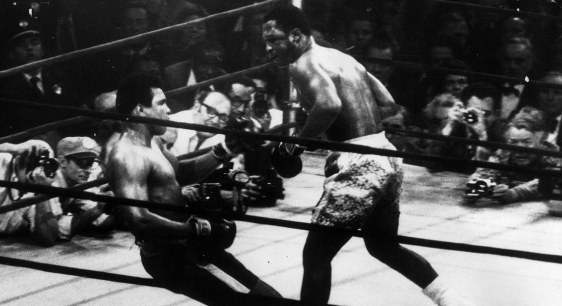 Muhammad Ali goes down in the 15th round after a left hook from world heavyweight champion Frazier in 1971, who kept the title with a unanimous points win.