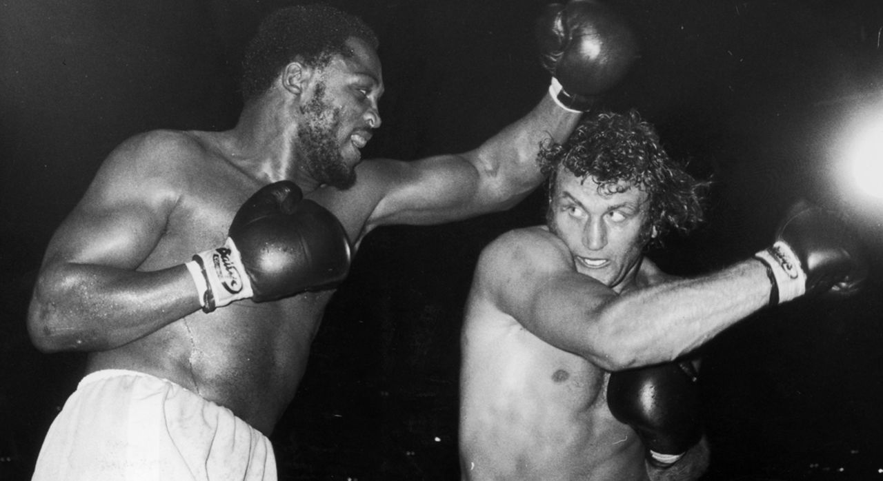 Frazier and Joe Bugner compete during a world title eliminator fight at Earl's Court, London, in 1973. Frazier emerged the winner after a very hard-fought match. 