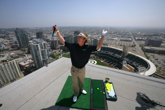 Baird celebrates after landing his ball off a hotel roof onto a bullseye at PETCO Park, home of the San Diego Padres baseball team, during a charity event in 2009.