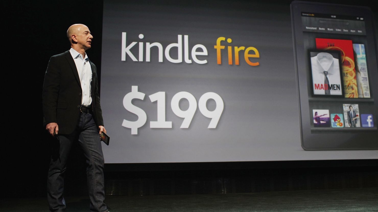 Amazon CEO Jeff Bezos surprises the crowd at the Kindle Fire announcement in September with a low $199 price tag.
