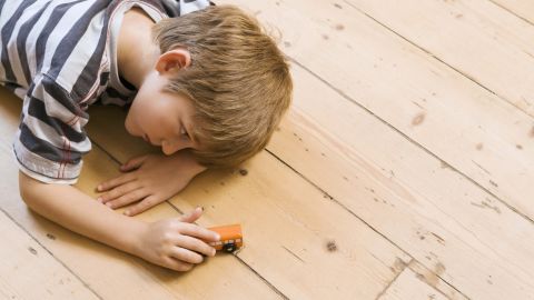 boy child playing car floor autism