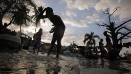 Haitians wash clothes in a stream in Port-au-Prince. The widespread user of rivers has been liked to the country's deadly cholera outbreak.