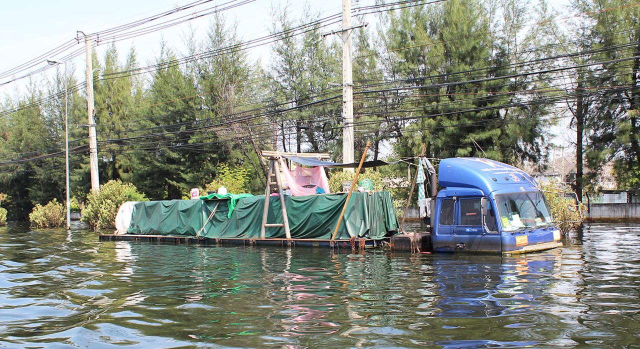 Some people have even set up a makeshift camp on the trailer of this partially-submerged lorry.
