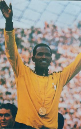 In a glittering career, the Kenyan athlete won gold medals in both the 1968 and 1972 Olympic Games as well as three golds at the Commonwealth Games .