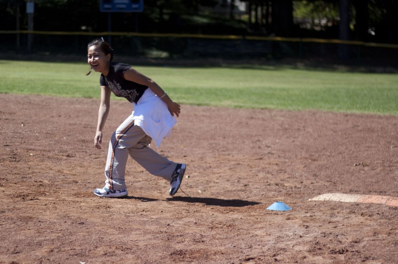 Rita, a 16-year-old from Myanmar (formerly Burma), runs to second base.