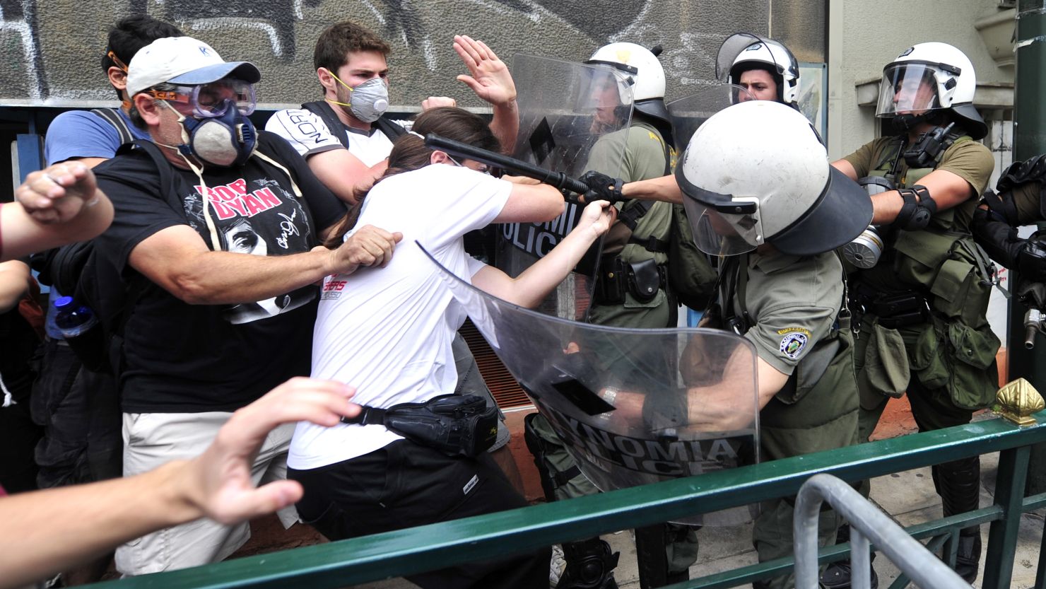 Protesters in Athens, Greece, clash with riot police during a 48-hour general strike in June.