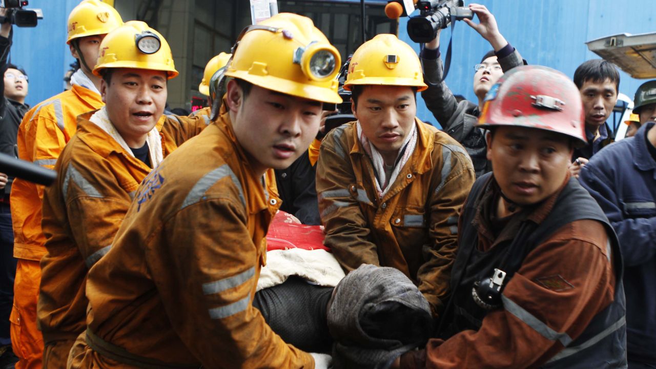 Rescuers carry out a miner from the Qianqiu colliery in Yima on November 5 2011.China has one of the world's deadliest records for miners. 