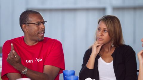 Seasoned Web entrepreneur Hank Williams, left, talking with NewMe co-founder Angela Benton.