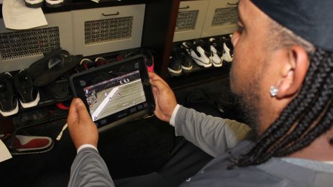 Tampa Bay Bucs tackle Donald Penn reviews game footage on his iPad, which has replaced the team's standard playbook. 