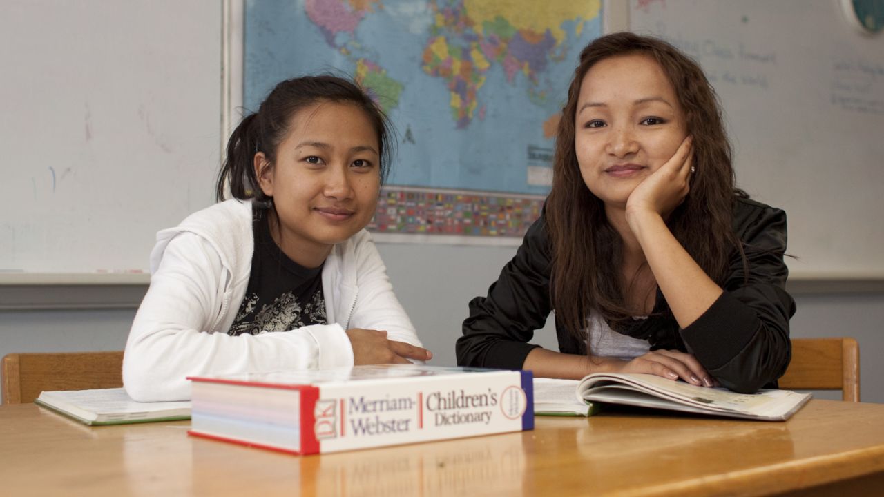 Sisters Rita, left, and Melody, right, left their parents behind when they came to the U.S. from Myanmar.