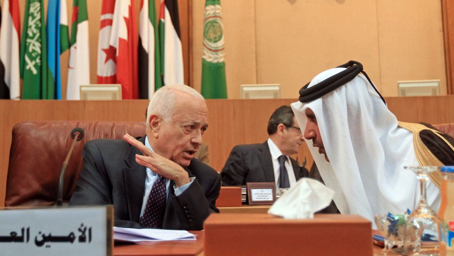 Qatari Prime Minister Sheikh Hamad bin Jassim, right, speaks to Arab League Secretary General Nabil al-Arabi on Saturday.
