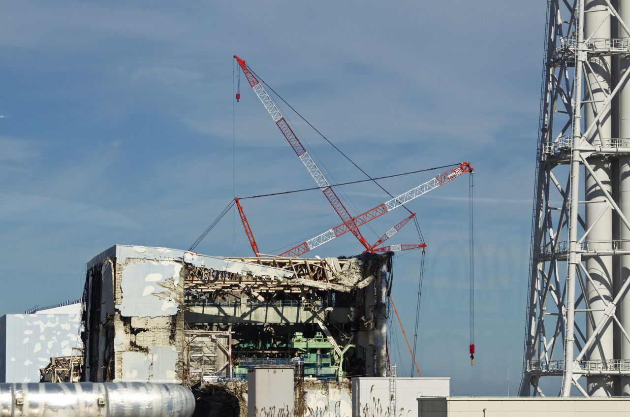 The crippled Fukushima Daiichi nuclear power station is seen through a bus window in Okuma on Saturday. An epic 9.0-magnitude earthquake and subsequent tsunami March 11 wreaked havoc around Japan, killing more than 15,000 people. While many of those died instantly, the East Asian nation was on edge for weeks as utility and government employees scrambled to prevent a worsening nuclear catastrophe at the Daiichi plant, located about 150 miles (240 kilometers) north of Tokyo.