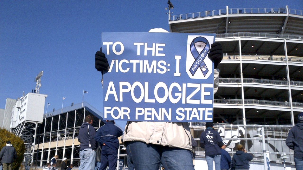 A Penn State student shows her reaction to the child abuse scandal outside Beaver Stadium on Saturday.