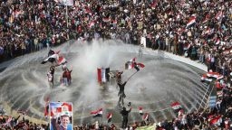 Syrians splash around in a fountain pond during a rally to show support for President Bashar al-Assad in Damascus on Sunday.