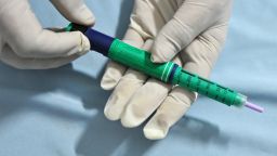 A medical assistant holds an insulin pen administered to diabetes patients at a private clinic in New Delhi on November 8, 2011.