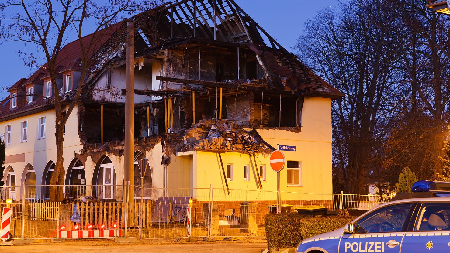 A police car stands in front of the burnt-out remains of the apartment that was once the residence of Uwe Mundlos, Uwe Boehnhardt and Beate Zschaepe on November 13, 2011 in Zwickau, Germany.