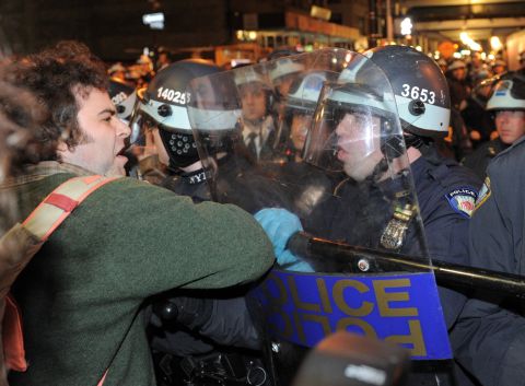 A man is confronted by police as New York City officials clear the 'Occupy Wall Street' protest from Zuccotti Park last November.