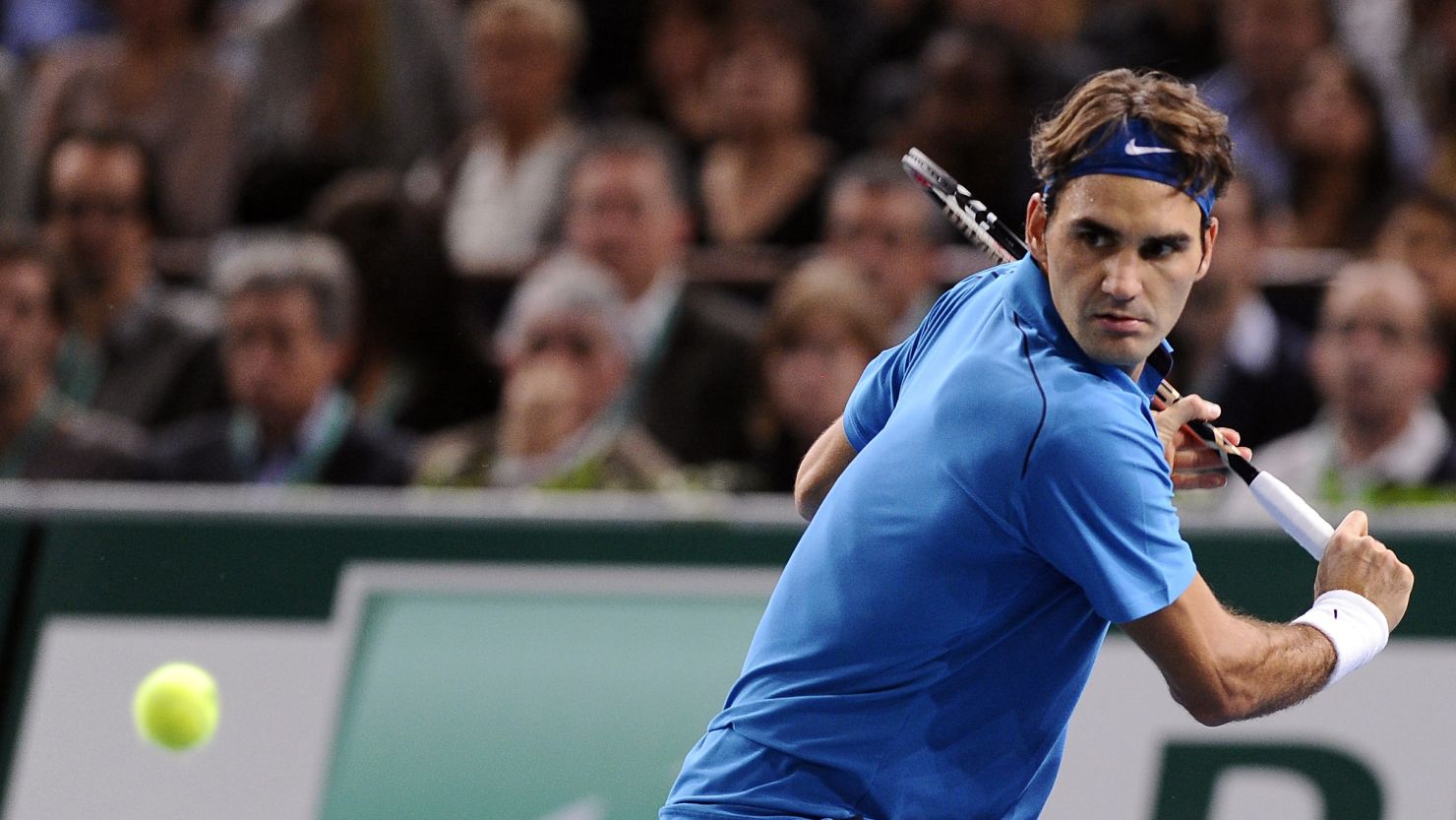 Roger Federer prepares to play a return during his Paris Masters final victory over Jo-Wilfried Tsonga