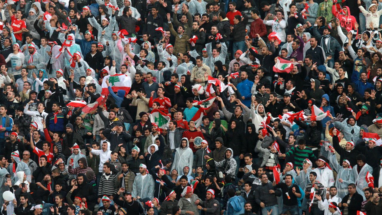 Lebanese fans celebrate their stunning 2-1 victory over South Korea in Beirut